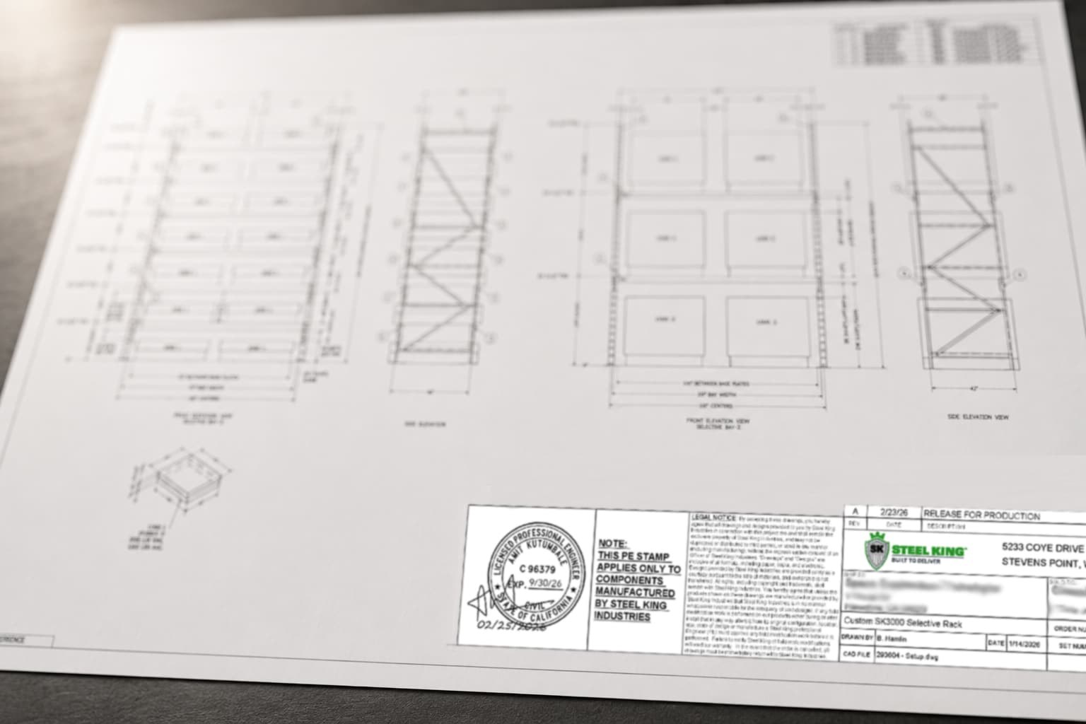 PE stamp2 Technical blueprint on a white desk showing floor plans, elevations, and stamped notes/N. piece of engineering drawing.