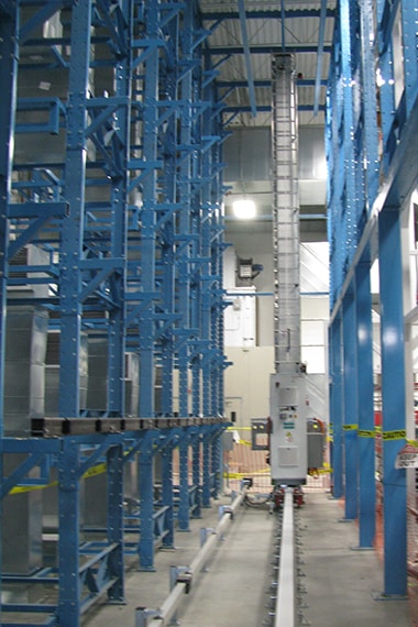 narrow rack aisle with crane